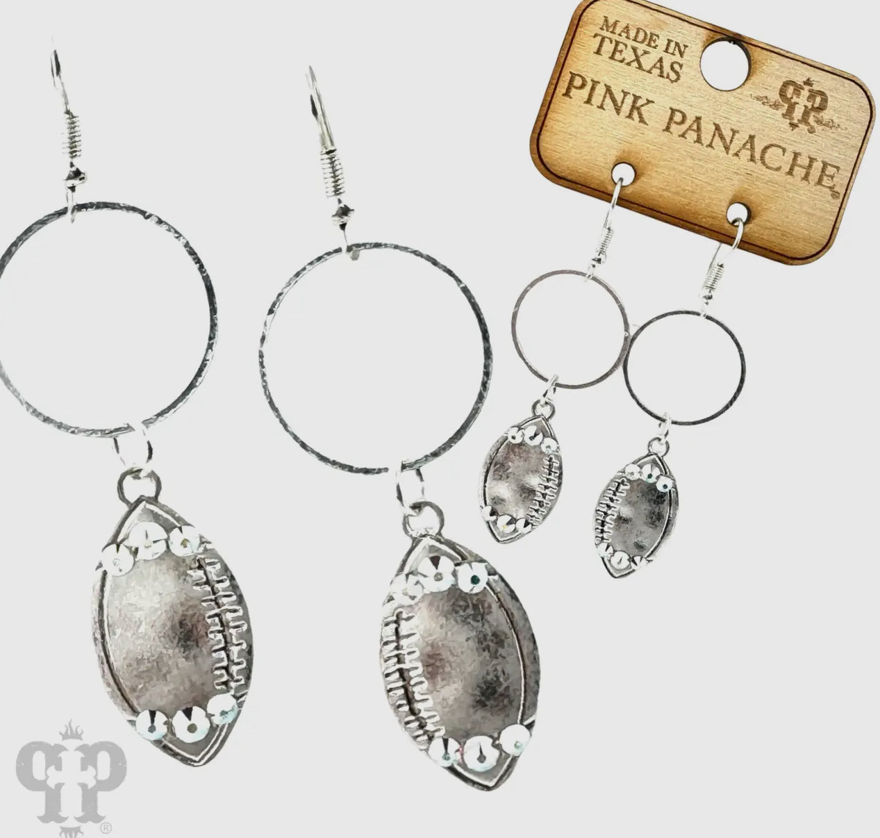 Silver football earring